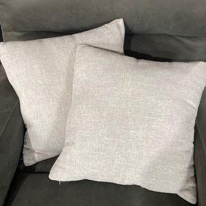 Set of light grey accent pillows